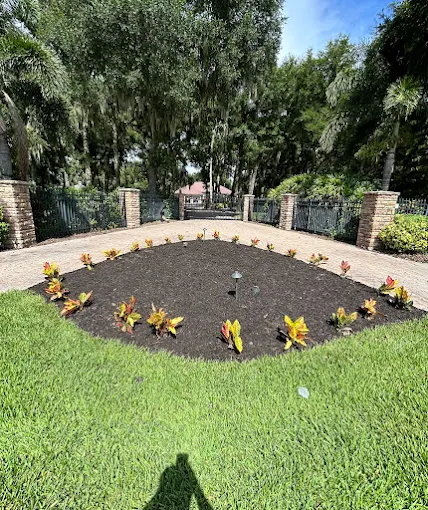 Fresh mulch island bed with new colorful plantings